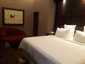 Postel nebo postele na pokoji v ubytování Alsalam Syariah Guesthouse