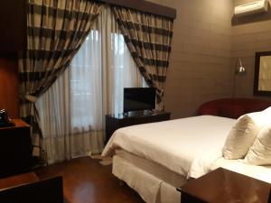 Postel nebo postele na pokoji v ubytování Alsalam Syariah Guesthouse