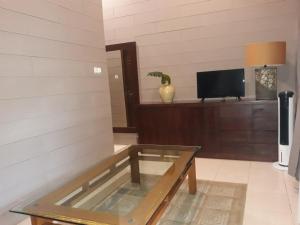 TV a/nebo společenská místnost v ubytování Alsalam Syariah Guesthouse