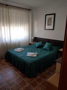Ein Bett oder Betten in einem Zimmer der Unterkunft Club Cristal Apartments