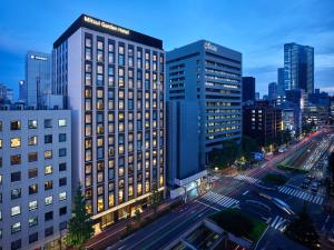 a view of a tall building in a city at Mitsui Garden Hotel Ginza-gochome in Tokyo