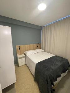 Cama ou camas em um quarto em Village dos Gerânios