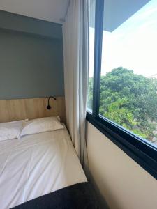 Cama ou camas em um quarto em Village dos Gerânios