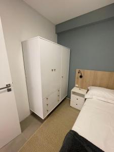 Cama ou camas em um quarto em Village dos Gerânios