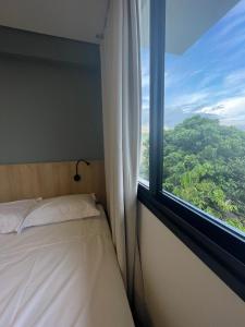 Cama ou camas em um quarto em Village dos Gerânios