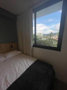 Cama ou camas em um quarto em Village dos Gerânios
