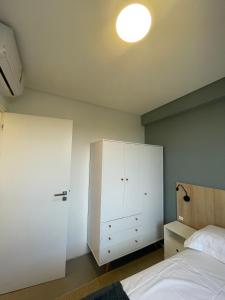 Cama ou camas em um quarto em Village dos Gerânios