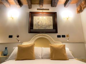 Postel nebo postele na pokoji v ubytování Ca' San Giorgio B&B