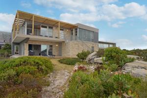 a house on a hill with a garden at Blueview on Silversand by Host Agents in Clareport