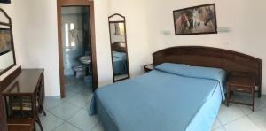 Postel nebo postele na pokoji v ubytování Hotel Castiglione