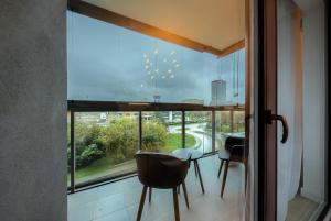 Balkon lub taras w obiekcie Kazou Residence Arkadia