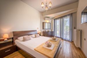 A bed or beds in a room at Astarte Villas - Istar Villa with Tennis Court