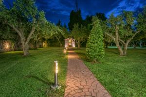 A garden outside Astarte Villas - Istar Villa with Tennis Court