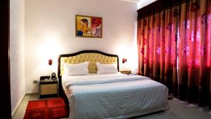 Millenium Popo Beach Hotel客房内的一张或多张床位