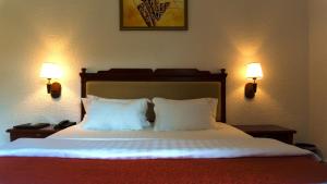 Millenium Popo Beach Hotel客房内的一张或多张床位