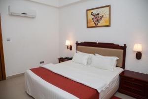 Millenium Popo Beach Hotel客房内的一张或多张床位