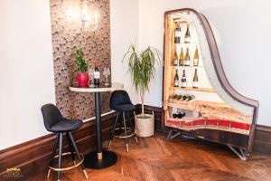 a dressing room with a mirror and two stools at Château d'Hermival in Hermival-les-Vaux