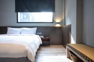 Letto o letti in una camera di Yunoyado Onsen Hot Spring Hotel Deyang