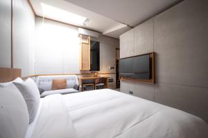 Letto o letti in una camera di Yunoyado Onsen Hot Spring Hotel Deyang