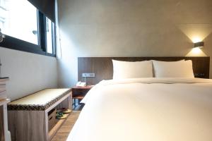 Letto o letti in una camera di Yunoyado Onsen Hot Spring Hotel Deyang