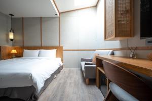 Letto o letti in una camera di Yunoyado Onsen Hot Spring Hotel Deyang