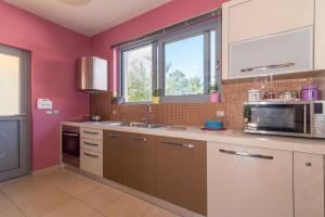 A kitchen or kitchenette at Astarte Villas - Istar Villa with Tennis Court