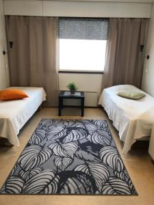Un pat sau paturi într-o cameră la Hostel Jailhouse Hamina