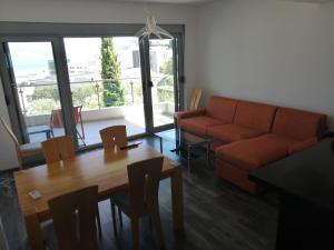 a living room with a couch and a table at Old Town View Apartment in Budva