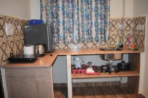 Kuhinja oz. manjša kuhinja v nastanitvi Spectrum Hub beach side Studio Apartment - Candolim - Goa
