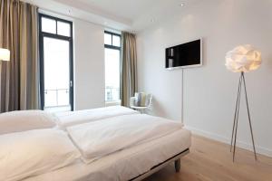 Ein Bett oder Betten in einem Zimmer der Unterkunft Villa Claire meerZEIT