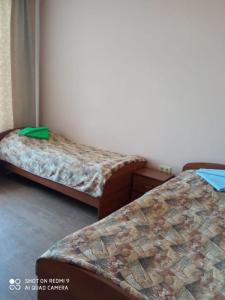 Кровать или кровати в номере Отель Олимпик