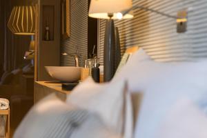 Postel nebo postele na pokoji v ubytování Boutique Hotel Valsabbion