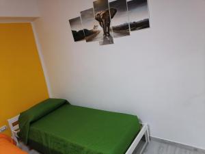Łóżko lub łóżka w pokoju w obiekcie Casa Mia