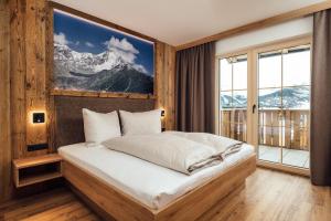 Postel nebo postele na pokoji v ubytování Alpenheimat Laurschhof