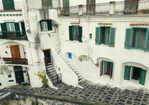 an aerial view of a building with stairs and windows at Lo scorcio del Borgo in Atrani +7 photos
