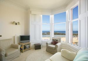 a living room with a view of the ocean at Linda Vista in North Berwick