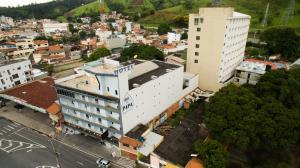 an aerial view of a city with a building at Hotel do Papa in Aparecida