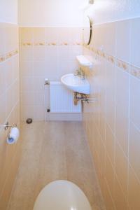 Koupelna v ubytování Ferienhaus Martens + 15 fotografií