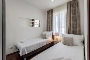 Posteľ alebo postele v izbe v ubytovaní Villa Meri very central and beautiful apartment