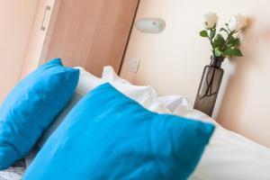Postel nebo postele na pokoji v ubytování Hotel Giove dipendenza Hotel Fiamma