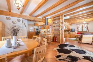 a kitchen and dining room with a table and chairs at Wili Hunter in Donovaly