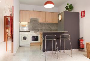 A kitchen or kitchenette at Portal Del Angel Barcelona Apartment