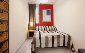 A bed or beds in a room at Portal Del Angel Barcelona Apartment