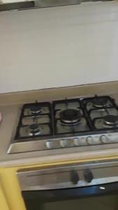 a stove top oven with a bunch of burners on it at Dre Broeders Apartments Juan Dolio in Juan Dolio