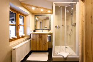 a bathroom with a shower and a sink at "Innsbruck Moments" Kasperhof Appartements in Innsbruck +103 photos