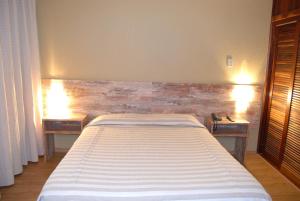 Cama ou camas em um quarto em Samuara Hotel Caxias do Sul