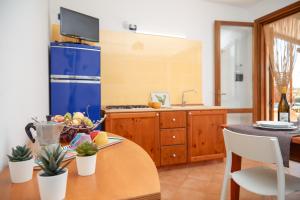 A kitchen or kitchenette at Residence I Faraglioni