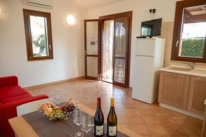 A television and/or entertainment centre at Residence I Faraglioni