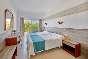 Ένα ή περισσότερα κρεβάτια σε δωμάτιο στο Apartamentos Ben-Hur +29 φωτογραφίες