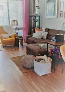 a living room with a couch and a table at Casa Naranja in Costa Del Silencio